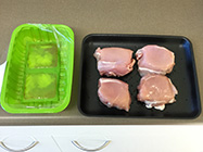 chicken pieces removed from package and placed on tare tray