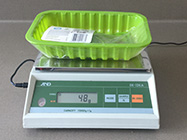 empty manufacturers packaging on scales